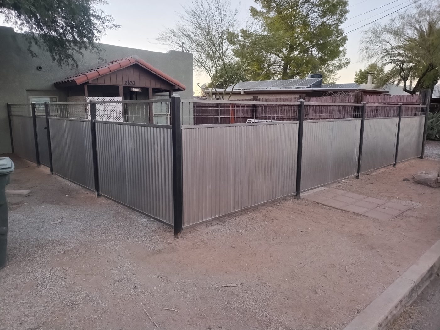 Black steel horizontal yard fence — Emery Welding & Ironwork