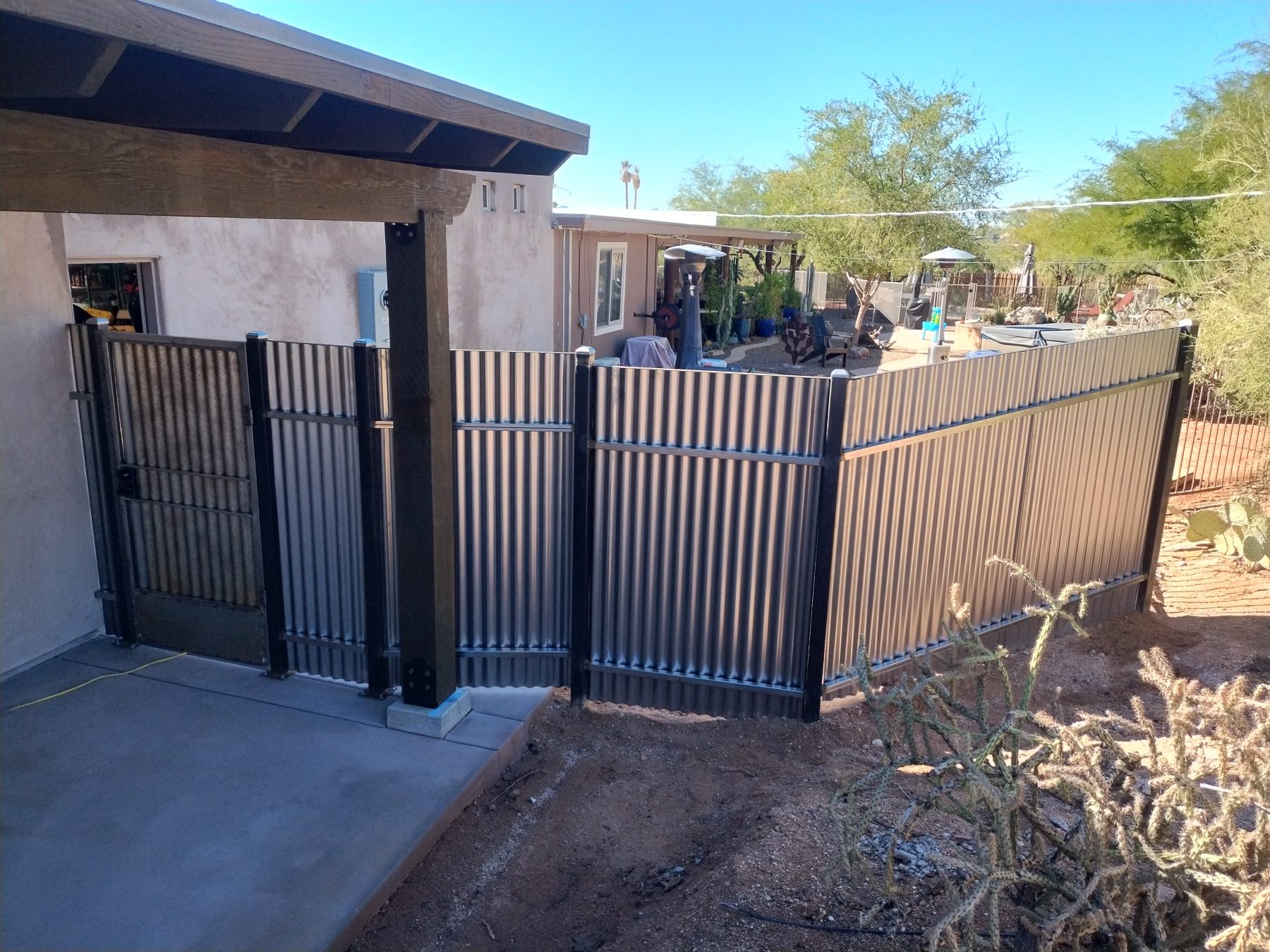 Black wrought iron double driveway gate in Tucson — Emery Welding & Ironwork