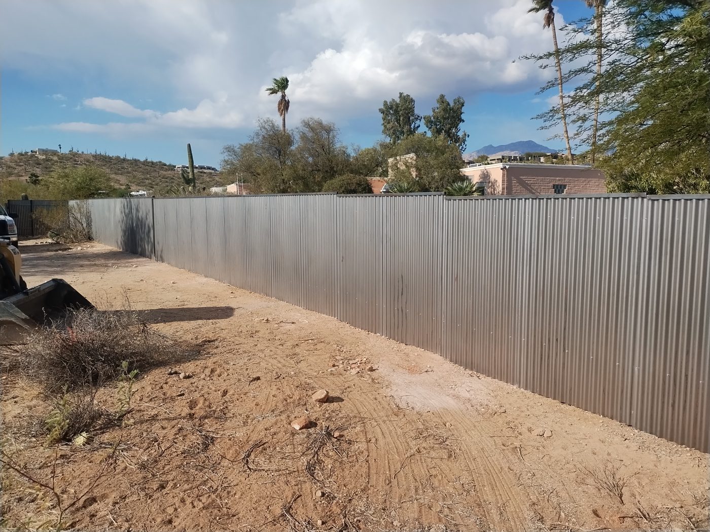 Corrugated metal fence long run — Emery Welding & Ironwork