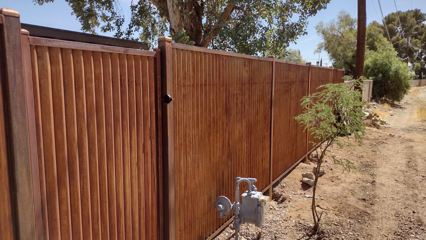 Corrugated metal privacy fence and gate — Emery Welding & Ironwork