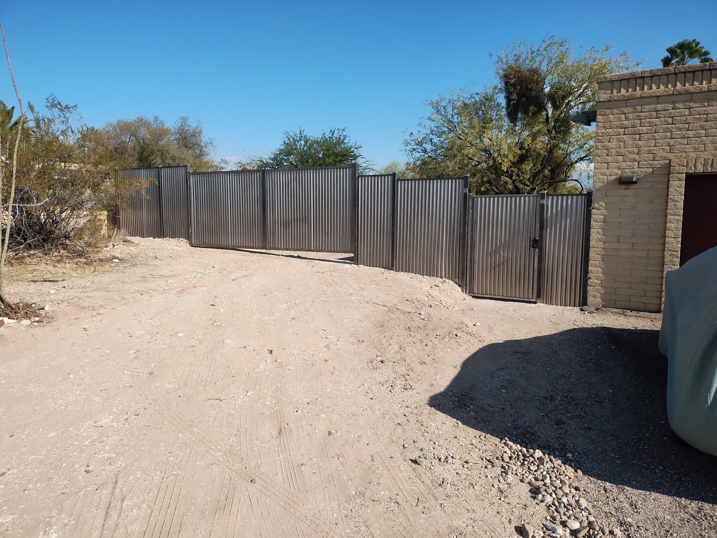 Corrugated privacy fence driveway — Emery Welding & Ironwork