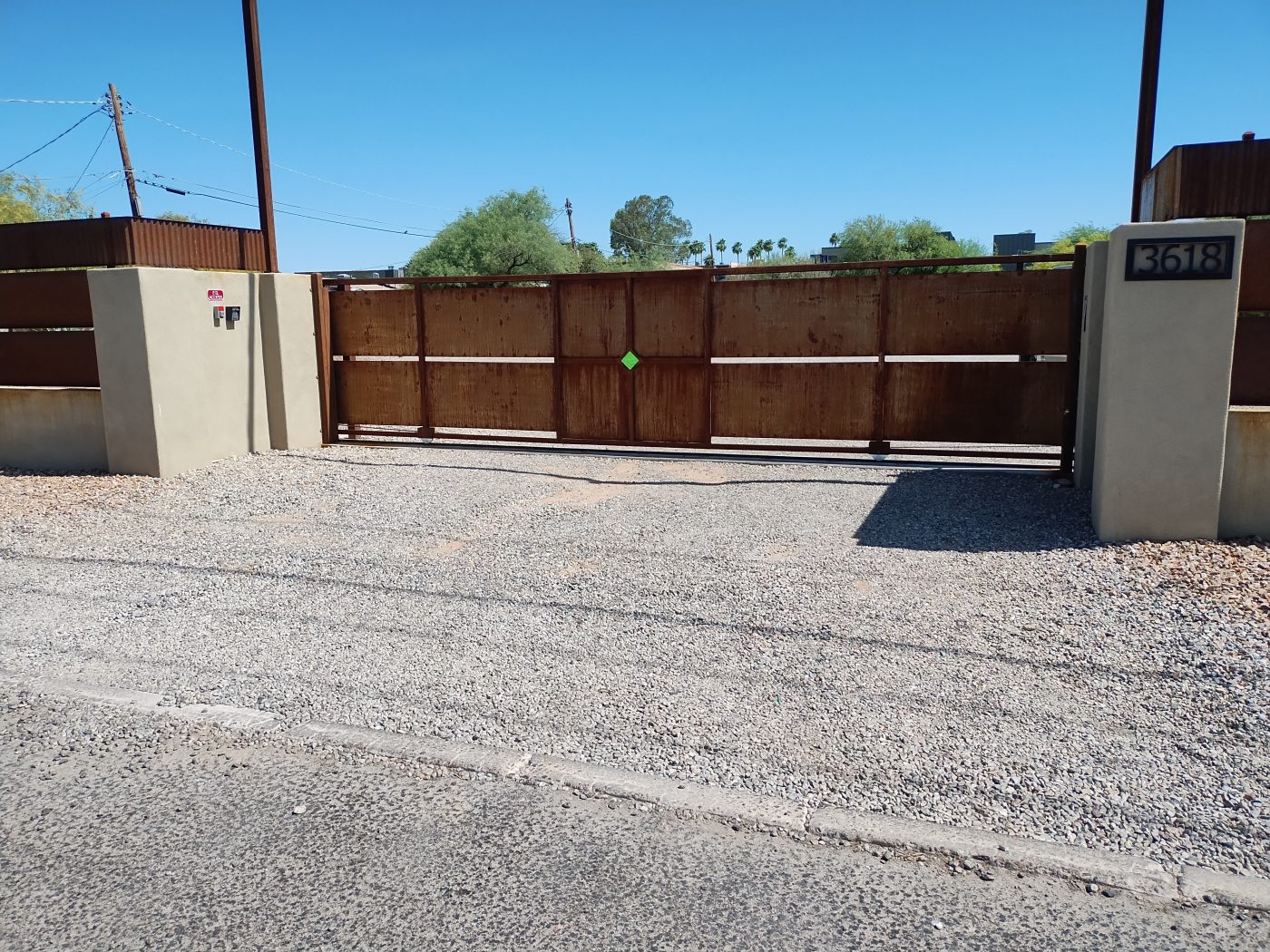 Corrugated steel sliding driveway gate — Emery Welding & Ironwork