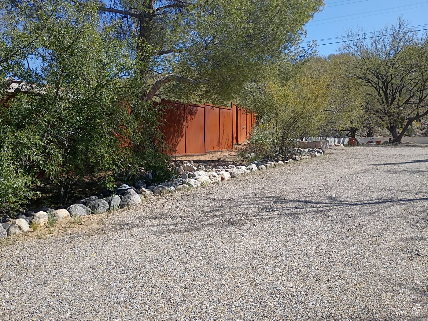 Corten steel fence desert road — Emery Welding & Ironwork