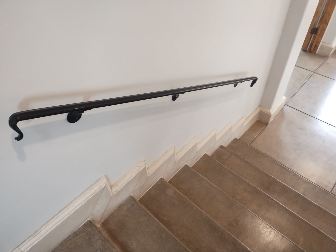 Curved steel handrail stairs — Emery Welding & Ironwork