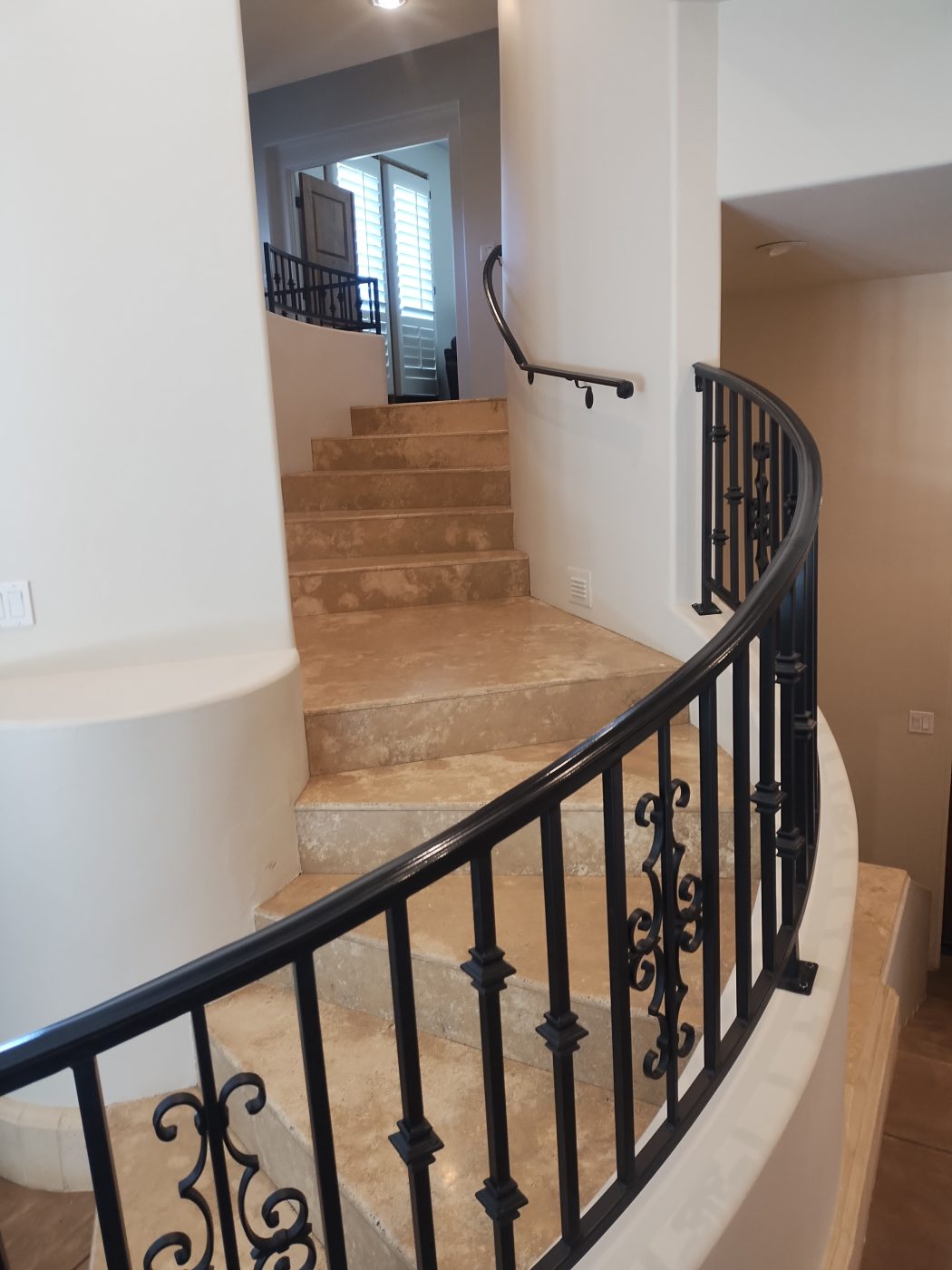 Curved wrought iron stair railing — Emery Welding & Ironwork