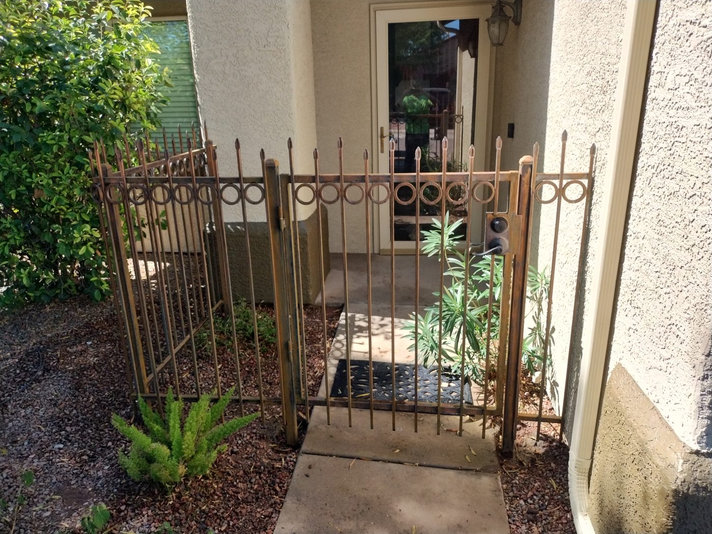 Iron fence and gate desert landscaping — Emery Welding & Ironwork