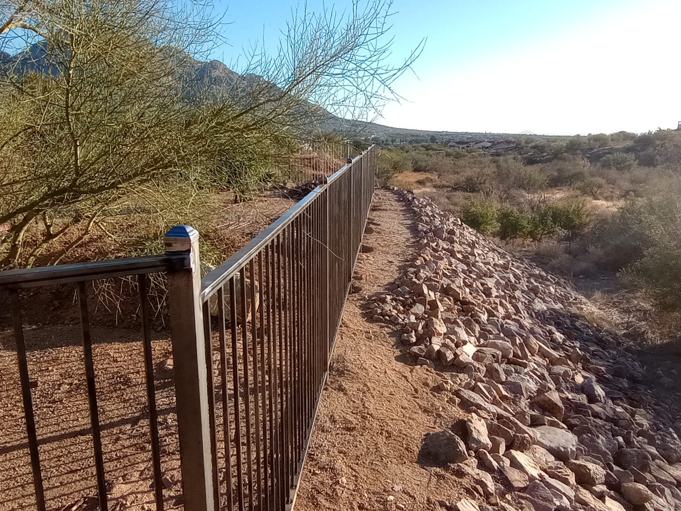Iron fence desert property line — Emery Welding & Ironwork