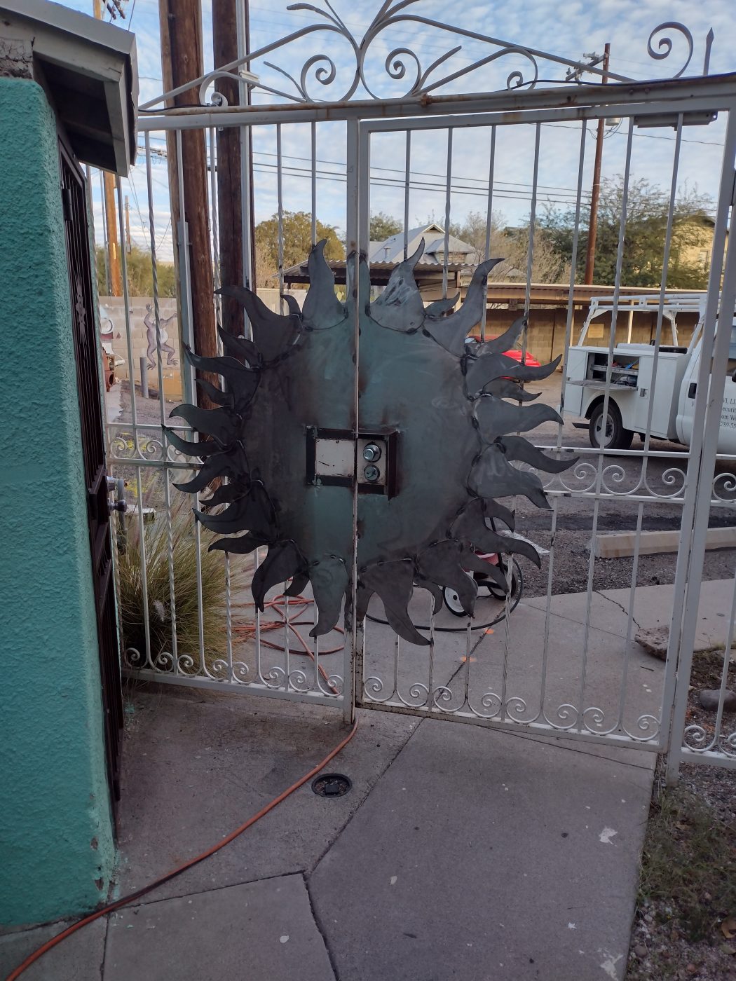 Metal sunburst art gate medallion — Emery Welding & Ironwork