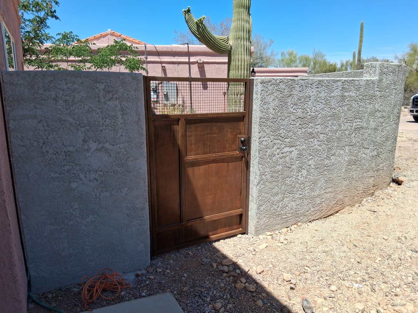 Painted block wall metal gate — Emery Welding & Ironwork