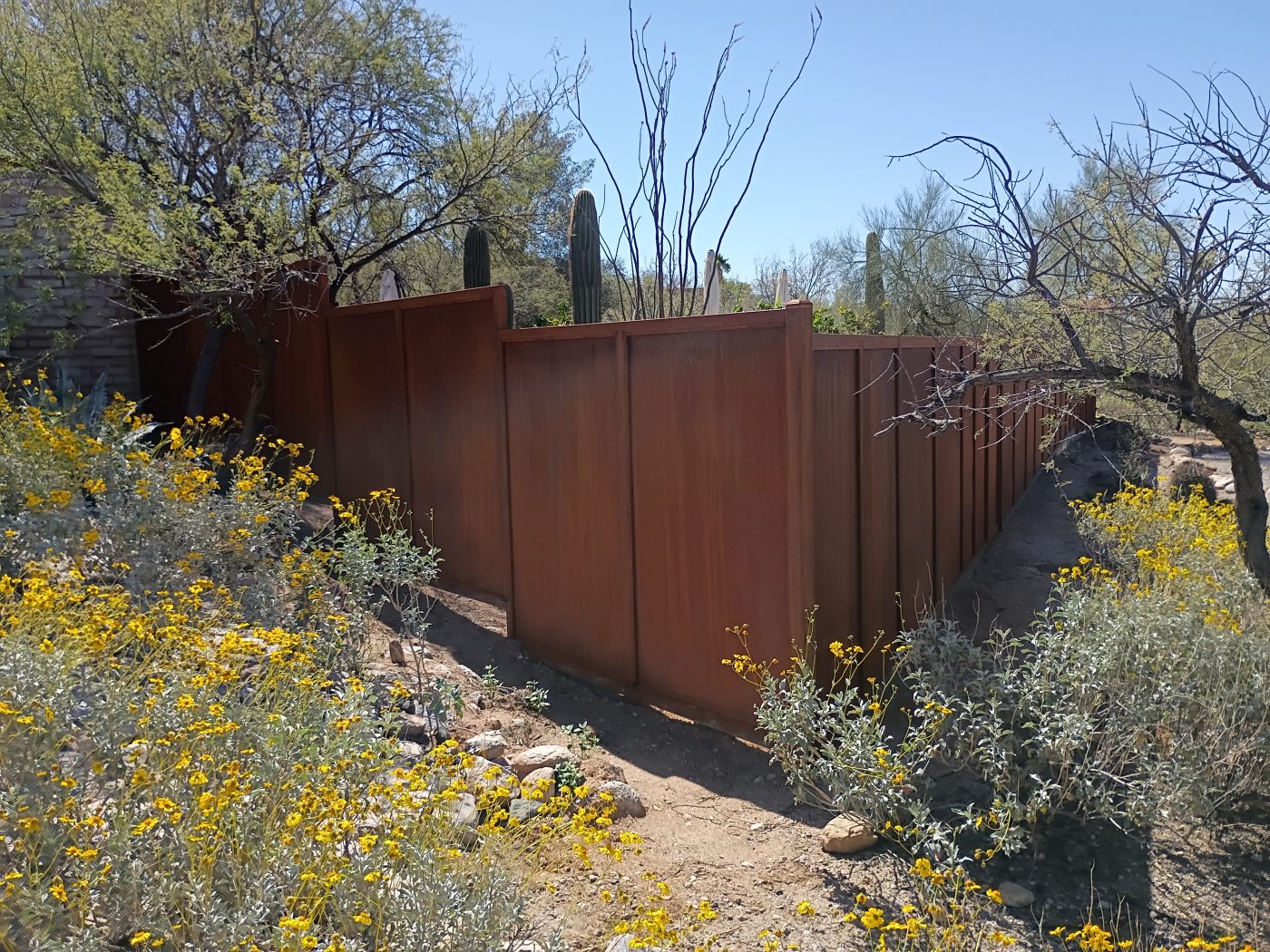 Weathered steel fence desert — Emery Welding & Ironwork