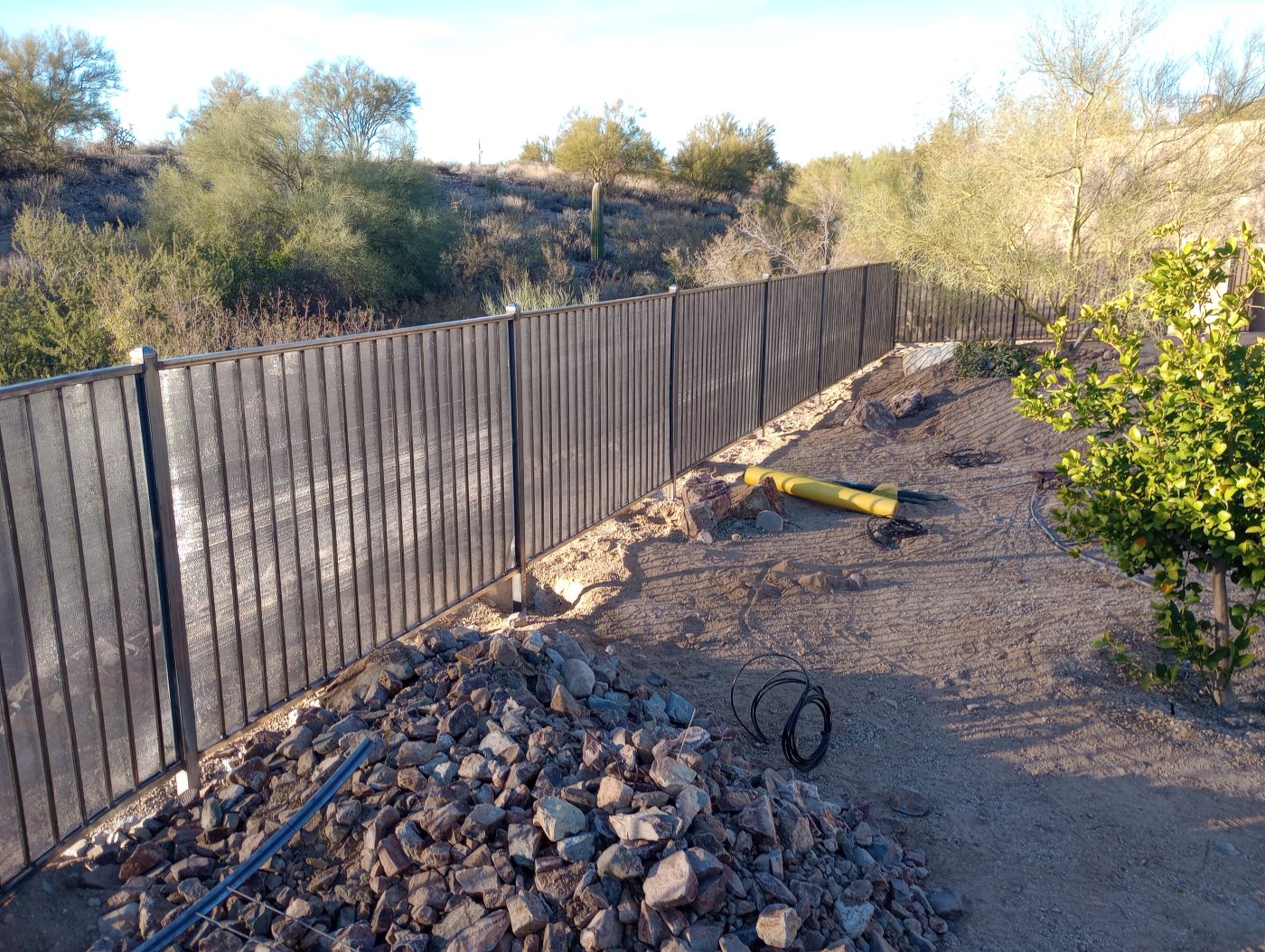 Wrought iron fence desert hillside — Emery Welding & Ironwork