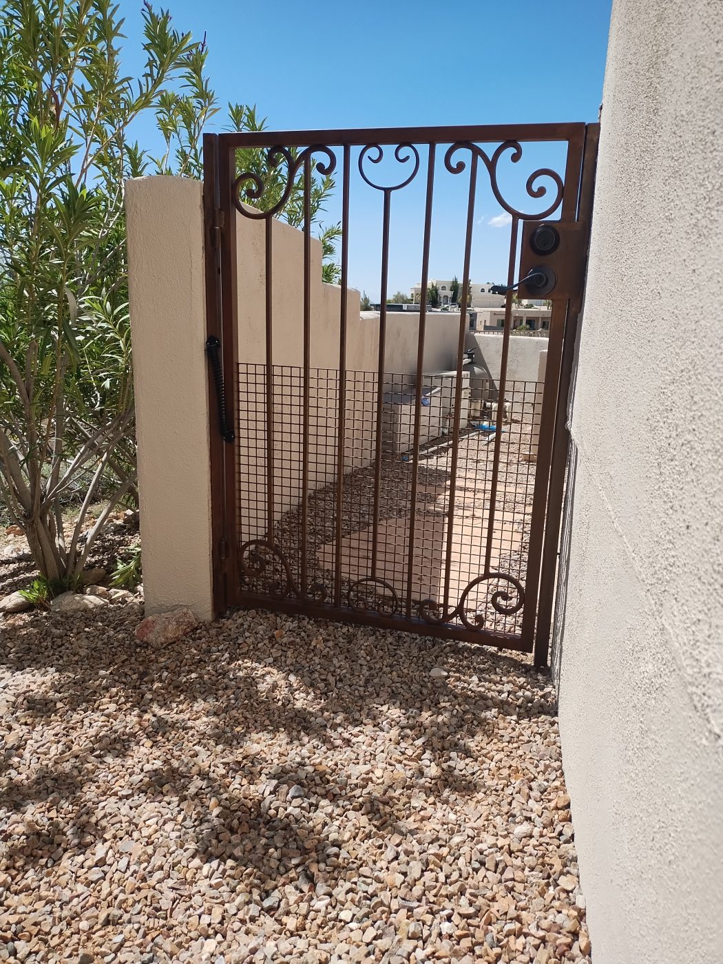 Wrought iron scrollwork gate desert — Emery Welding & Ironwork